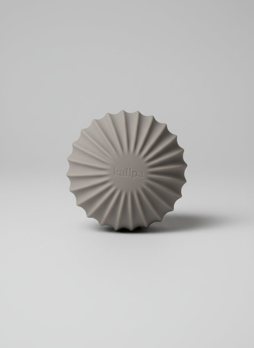 Sleek andes taupe strength 1.5kg training ball (front side) with textured silicone grip for controlled home mobility