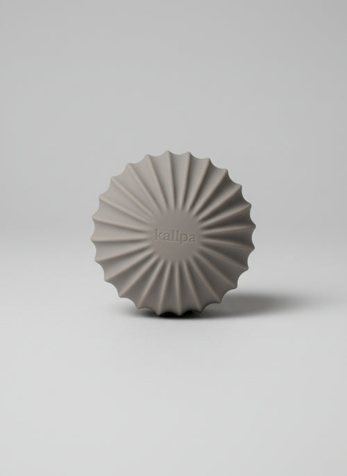 Sleek andes taupe strength 1.5kg training ball (front side) with textured silicone grip for controlled home mobility