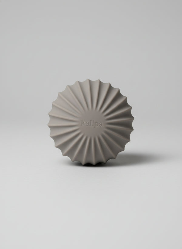 Sleek andes taupe strength 1.5kg training ball (front side) with textured silicone grip for controlled home mobility