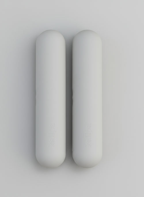 Two hand weights 2kgs in grey background with shadows