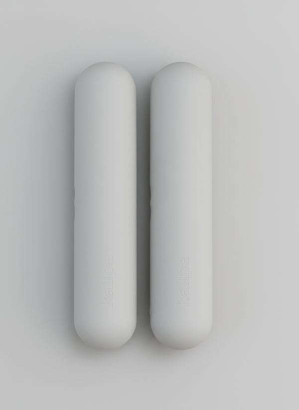 Two hand weights 2kgs in grey background with shadows